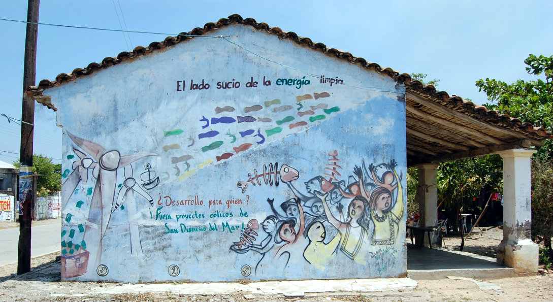 "The dirty side of wind energy", depicts a wall in San Dionisio del Mar, Oaxaca, in the South of Mexico