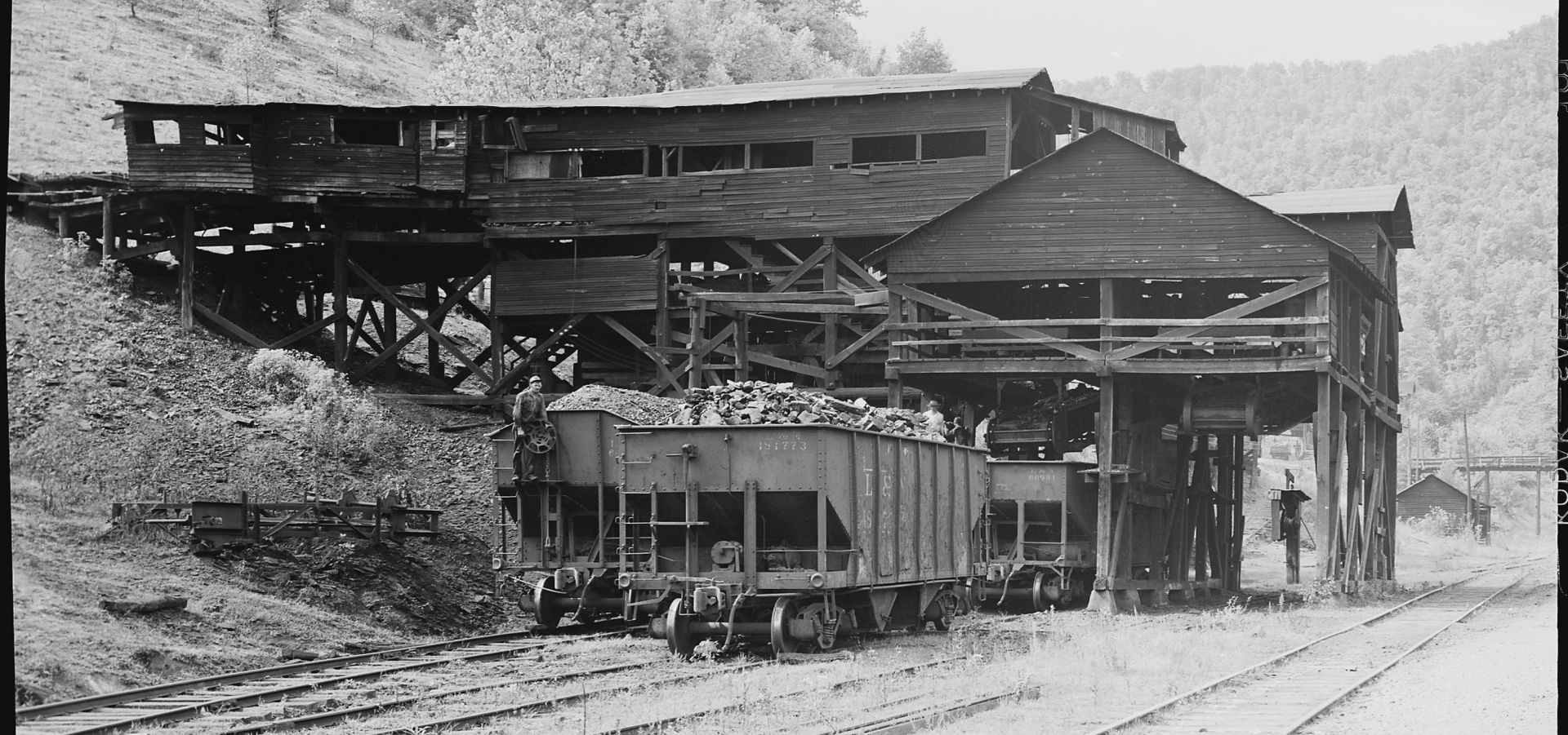 Black and white photo of coal mining tipple, from the PV&K Coal Company. Taken in 1946 in Harlan County, Kentucky. 