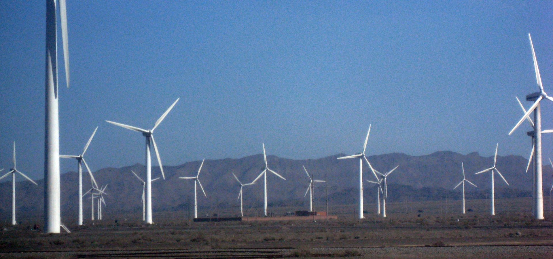 Wind farm in Xinjiang, China, on a sunny day.