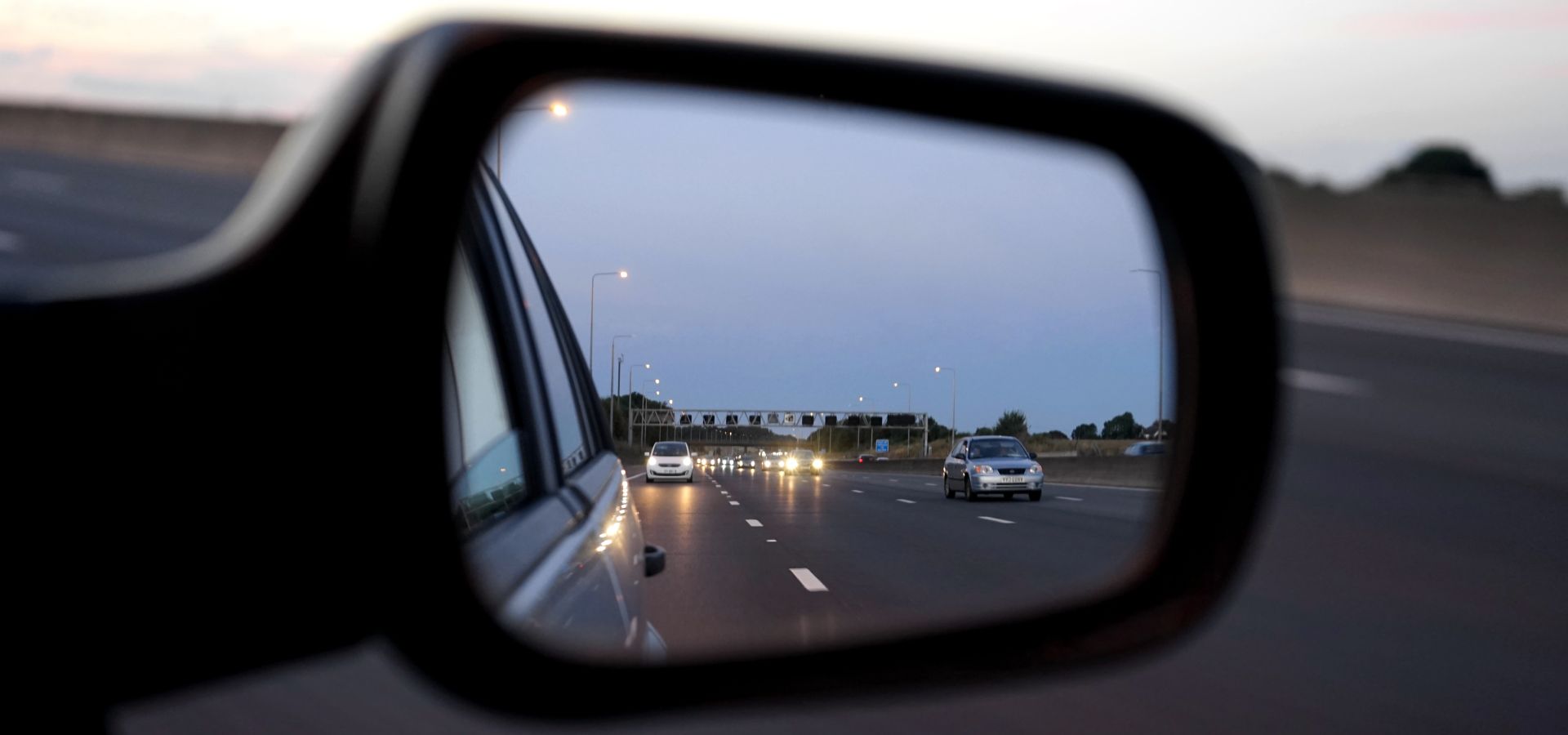 view of the autobahn from a rear view mirror