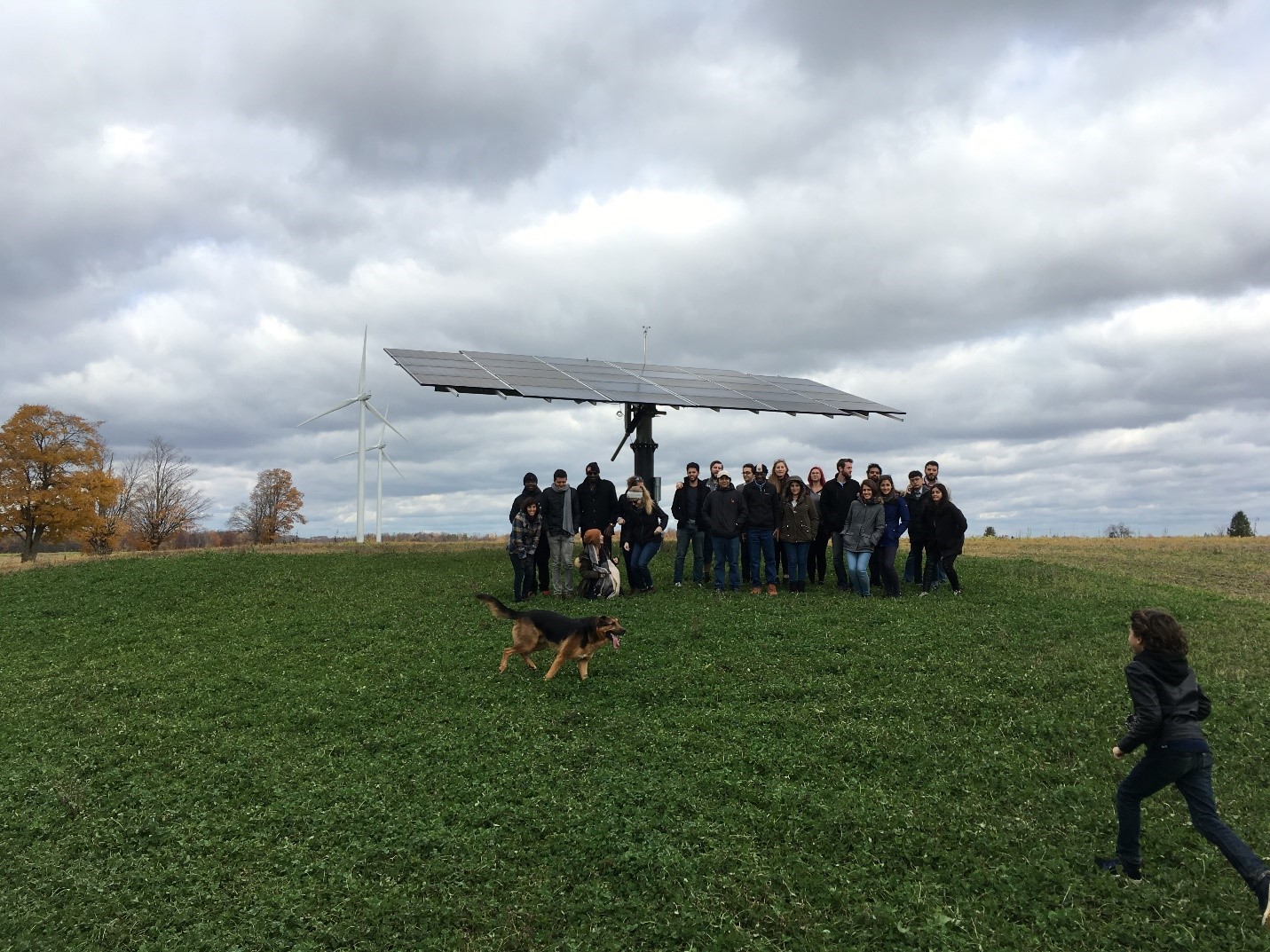 students stand in front of Solar panel in York, Oxford County, Canada