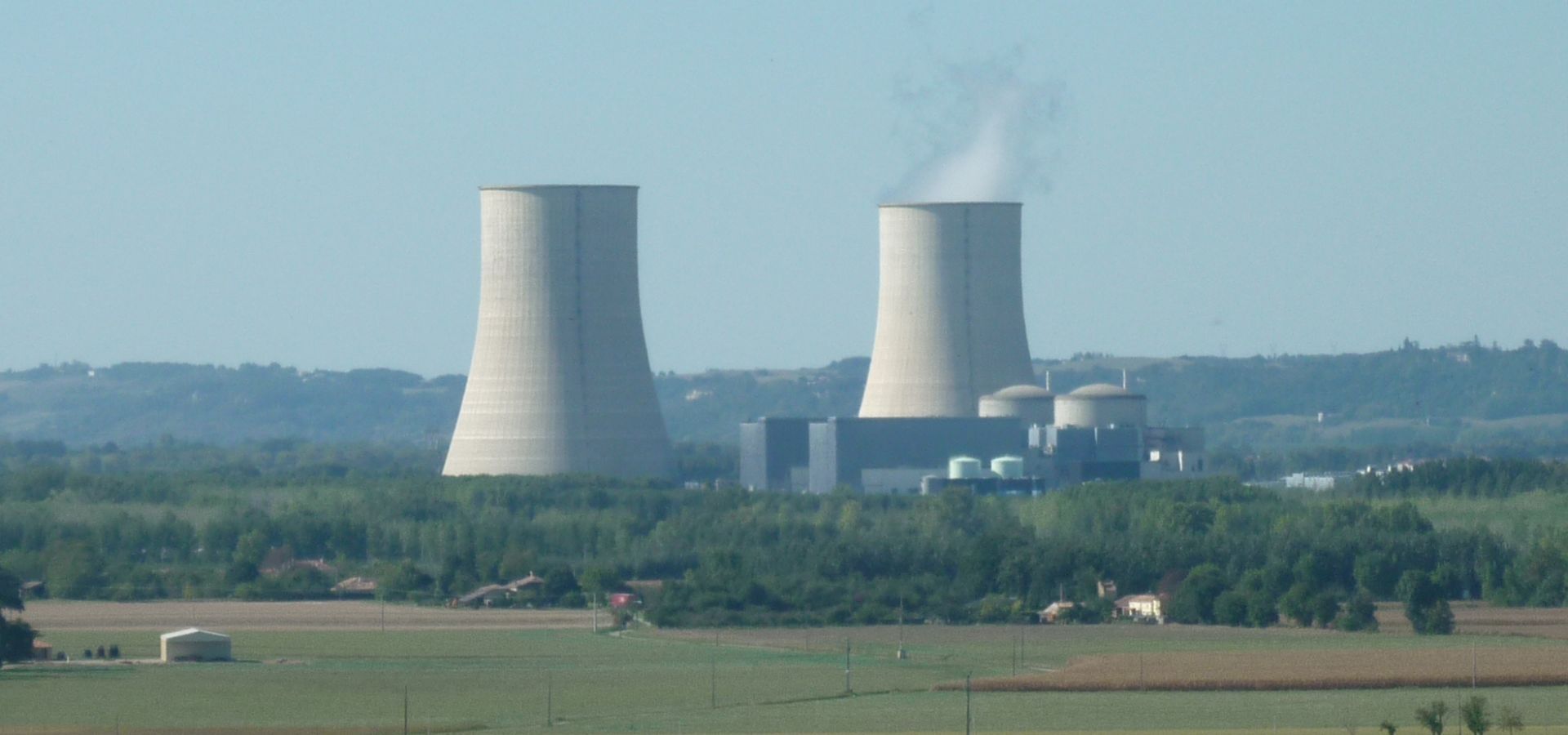 nuclear plant Golfrech shown from a field, steam coming from one tower