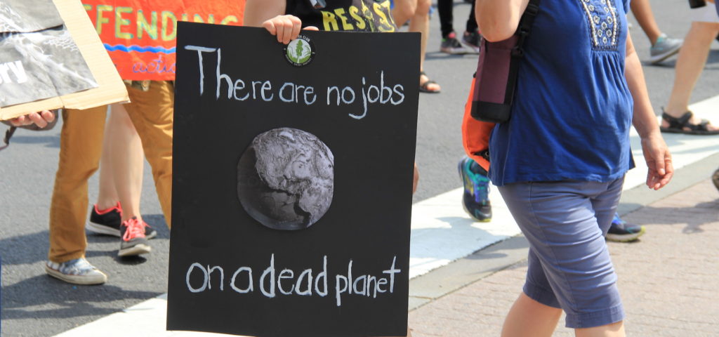 People's Climate March 2017 in Washington DC. Marchers with sign, "There are no jobs on a dead planet."