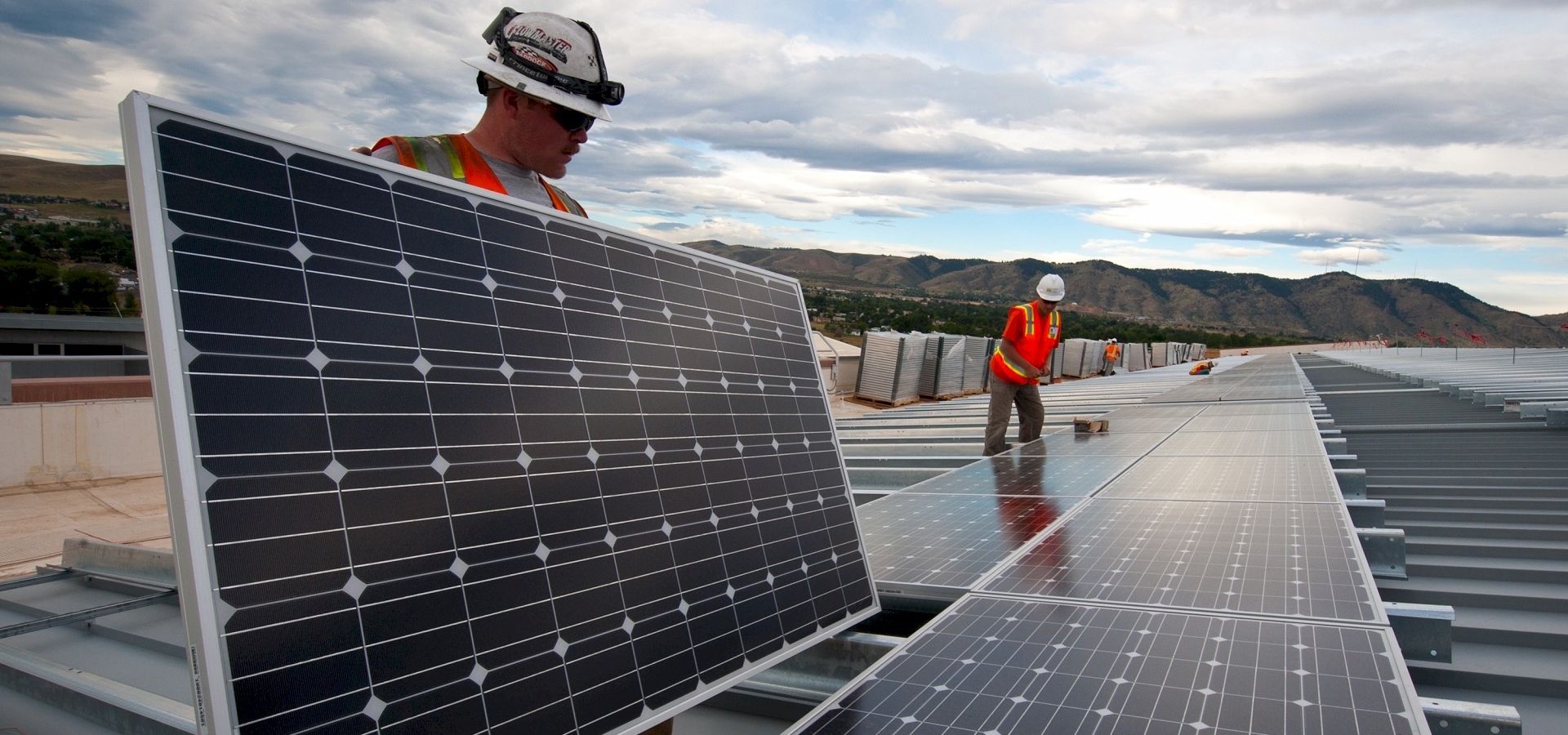 solar workers installing panels