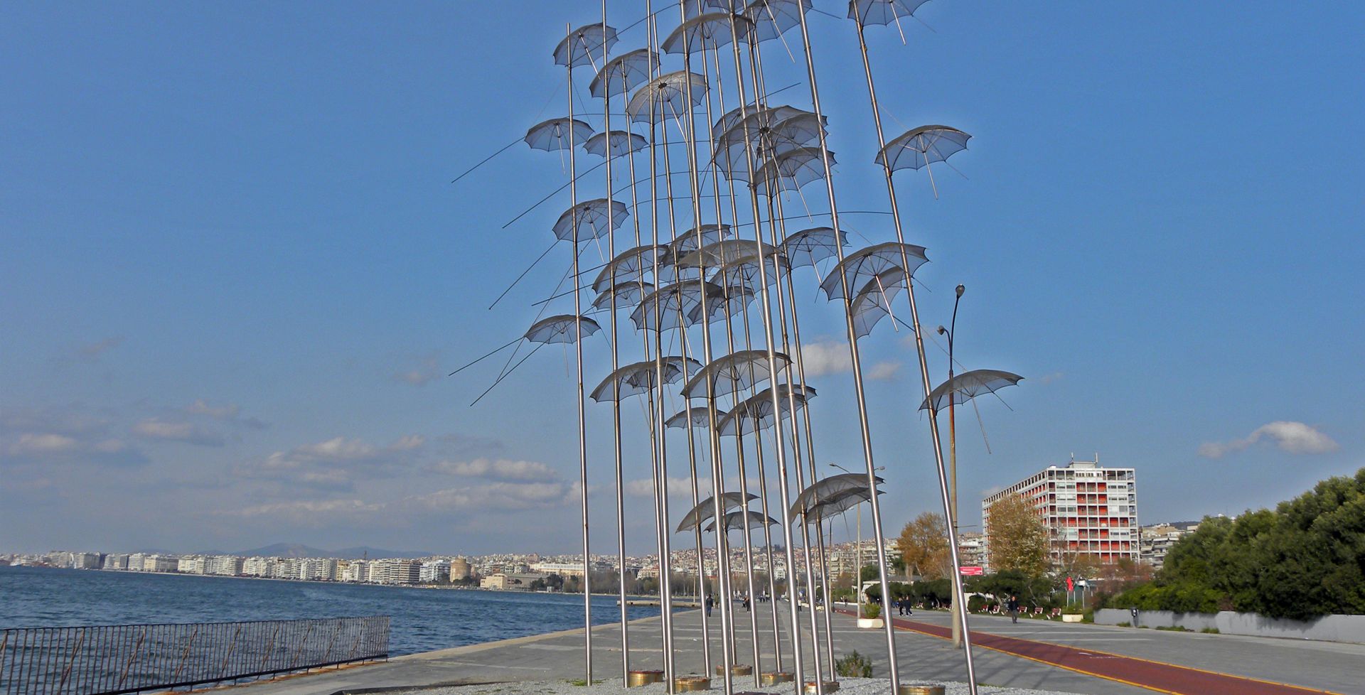 view of the seaside at Thessaloniki, Greece with statue of flying umbrellas