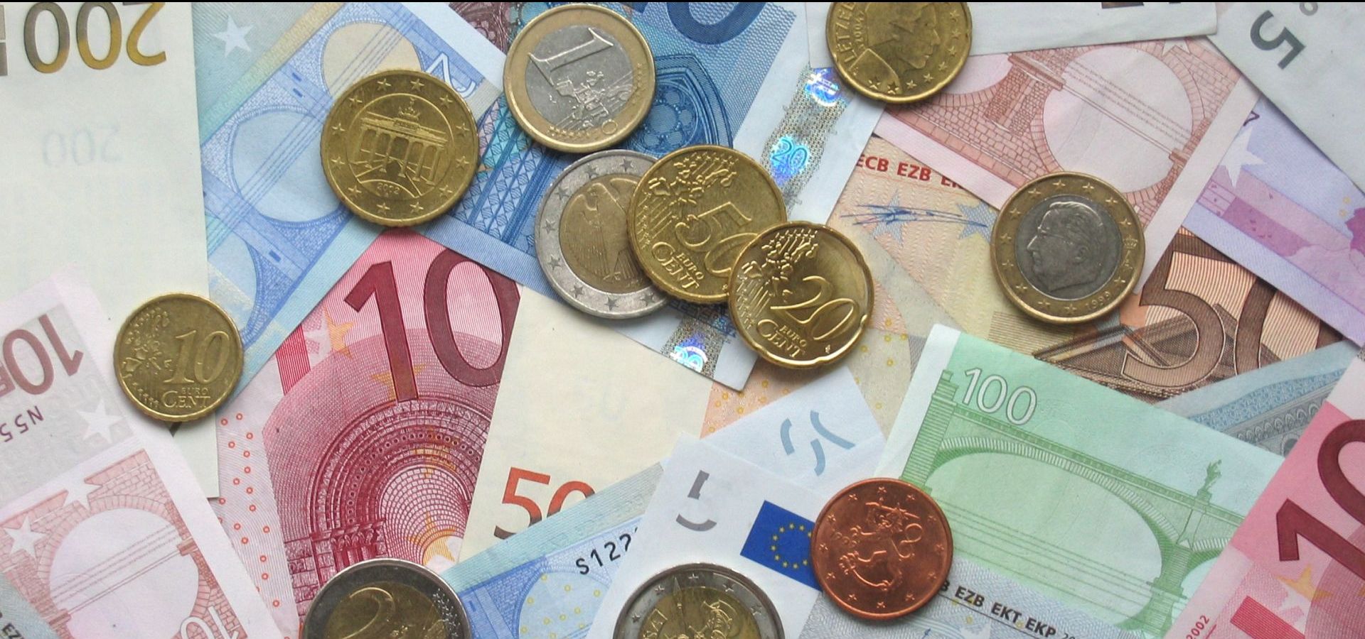 bank notes and various euro coins