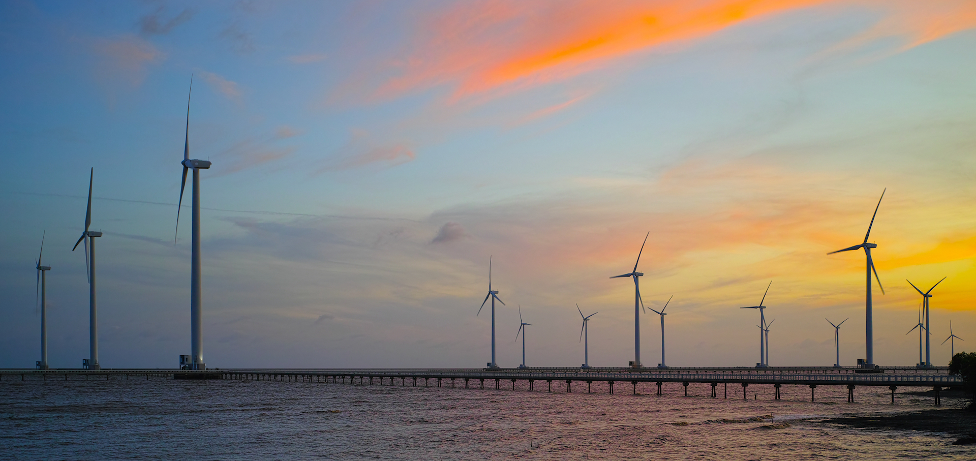 Offshore wind with sunset reflected in water
