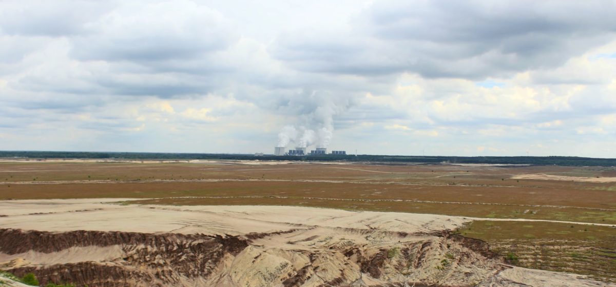 panorama of old coal mine with cooling towers in the background