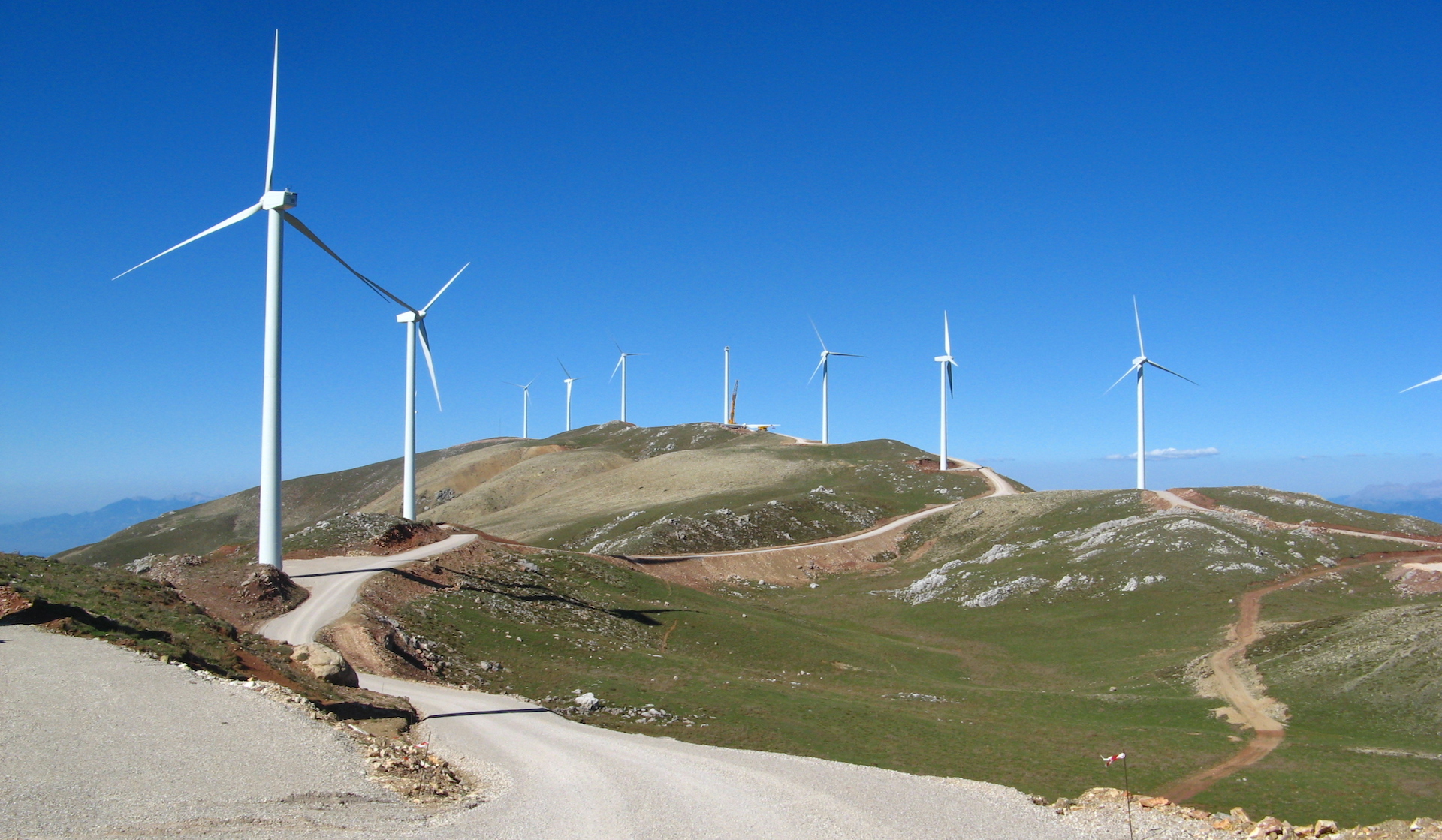 view of turbines along the coastline in the Panachaiko Greece