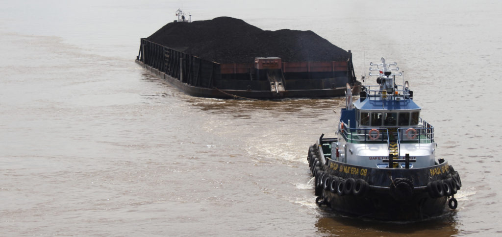 A barge from Samarinda coal mine on the Mahakam river, Indonesia