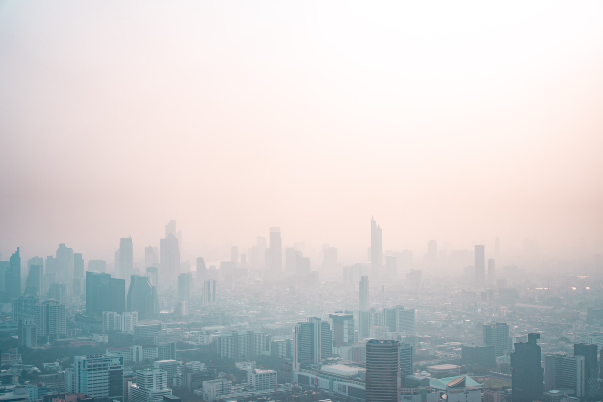 smogged city skyline - License: © Nick van den Berg